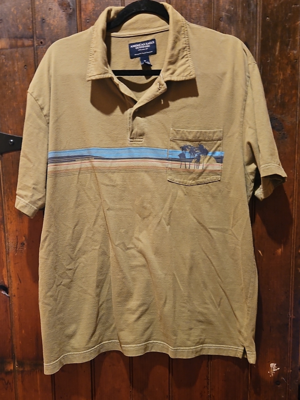 American Eagle Outfitters Tan Short-Sleeve Polo with Blue Stripe and Palm Pocket